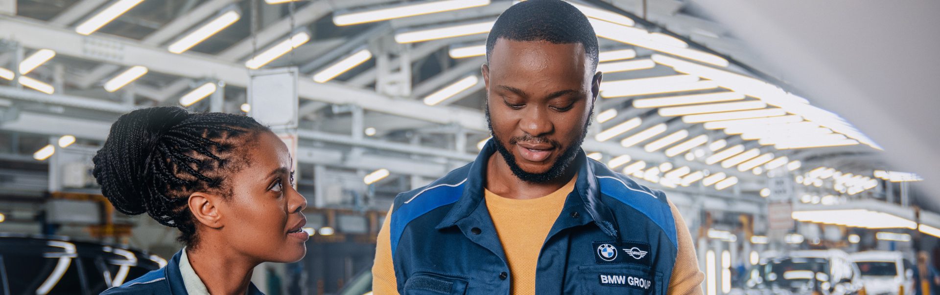Two South African colleagues having a conversation in the production hall